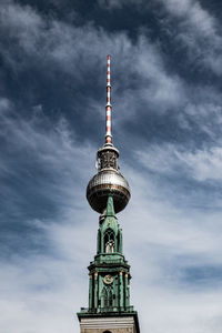 Low angle view of communications tower against sky