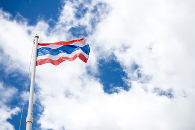 Low angle view of thai flag against sky