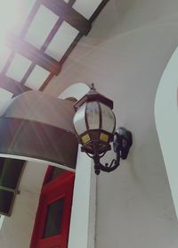 Low angle view of lantern hanging against sky