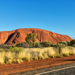 Scenic view of landscape against clear blue sky