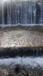 Scenic view of water flowing through rocks