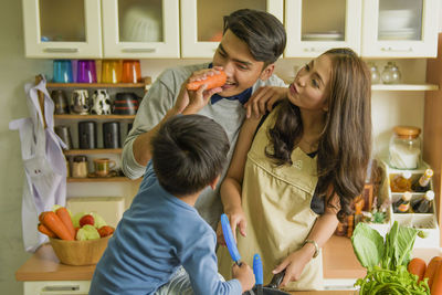 Side view of mother and daughter at home