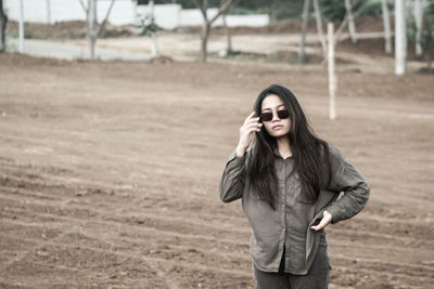 Young woman standing on land