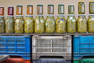 Multi colored bottles in shelf at store