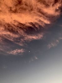 Low angle view of dramatic sky during sunset