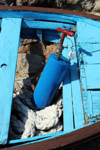 High angle view of rope tied on metal