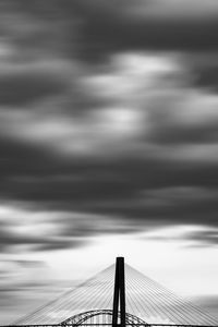 Silhouette bridge against sky