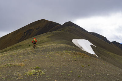 Man hiking on hill