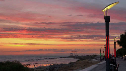 Scenic view of beach against sky during sunset