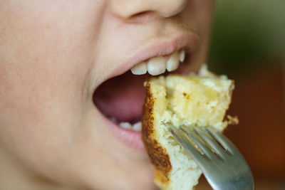 Close-up of woman eating food