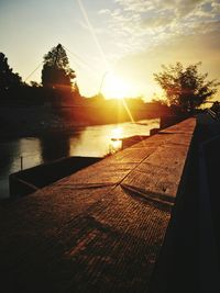 Scenic view of river at sunset