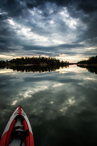 High angle view of kayak in baltic sea against cloudy sky during sunset