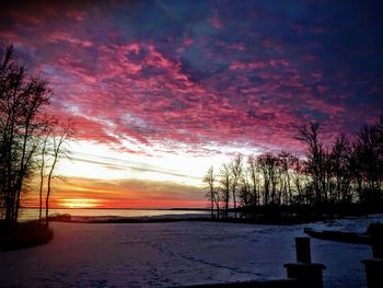 Scenic view of field against sky during sunset
