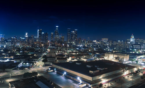 High angle view of illuminated buildings in city at night