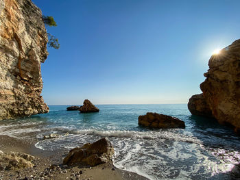 Scenic view of sea against clear blue sky