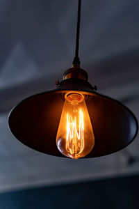 Low angle view of illuminated light bulb