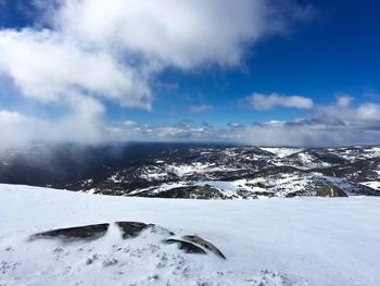 Scenic view of snowcapped mountains against sky