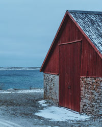 House by sea against sky