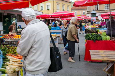 Group of people at market stall