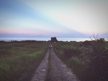 Scenic view of field against sky during sunset