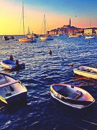 Boats moored on sea against sky