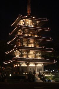 Low angle view of illuminated building at night