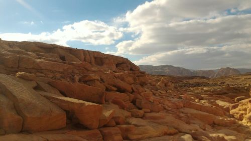 Scenic view of mountain against cloudy sky