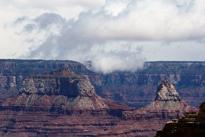 Panoramic view of rock formations against sky