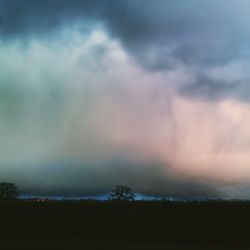 Scenic view of landscape against cloudy sky