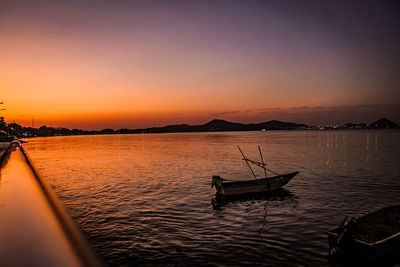 Scenic view of lake against sky during sunset