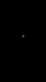 Low angle view of moon against sky at night