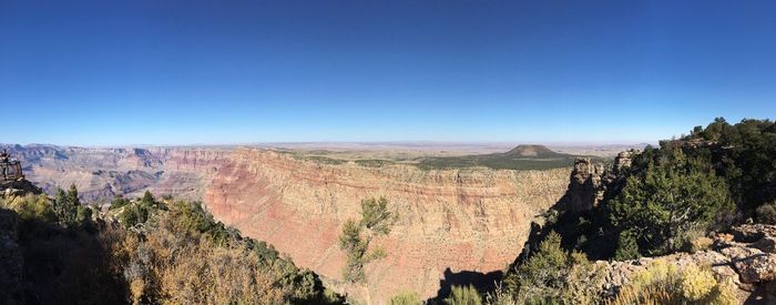 Scenic view of landscape against blue sky