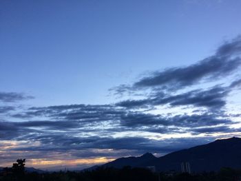 Low angle view of silhouette mountain against sky during sunset