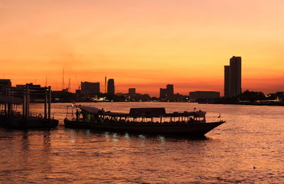 Scenic view of river against sky during sunset