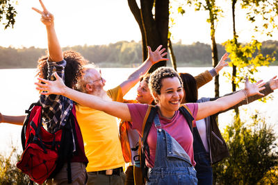 Portrait of friends enjoying in park