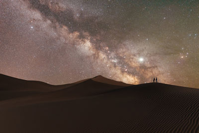 Scenic view of star field against sky at night