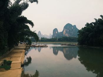 Scenic view of lake with mountains in background