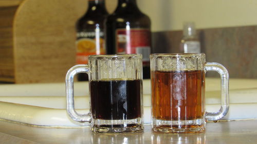 Close-up of shot glasses on table