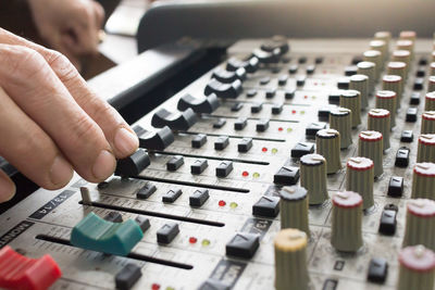 Cropped image of person using sound mixer