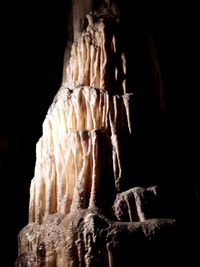 Low angle view of statue against black background