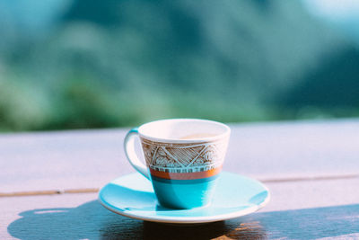 Close-up of coffee cup on table