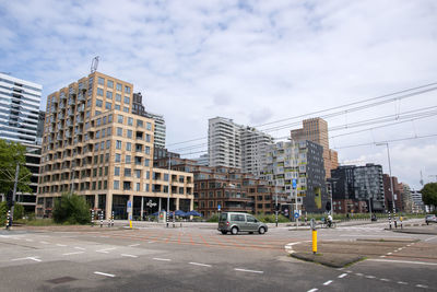 Buildings in city against sky