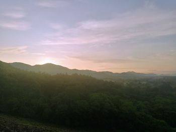 Scenic view of mountains against sky during sunset