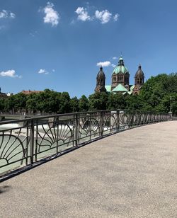 View of arch bridge and building against sky