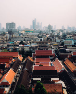 High angle view of buildings in city against clear sky