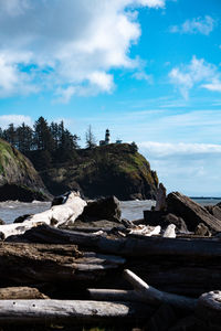 Rocks on beach against sky