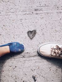 Low section of person standing on ground