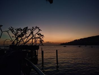 Scenic view of sea against clear sky during sunset