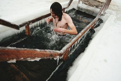 High angle view of man swimming in pool