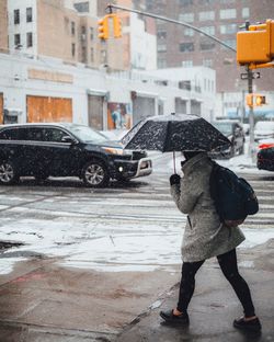 Woman standing on city street